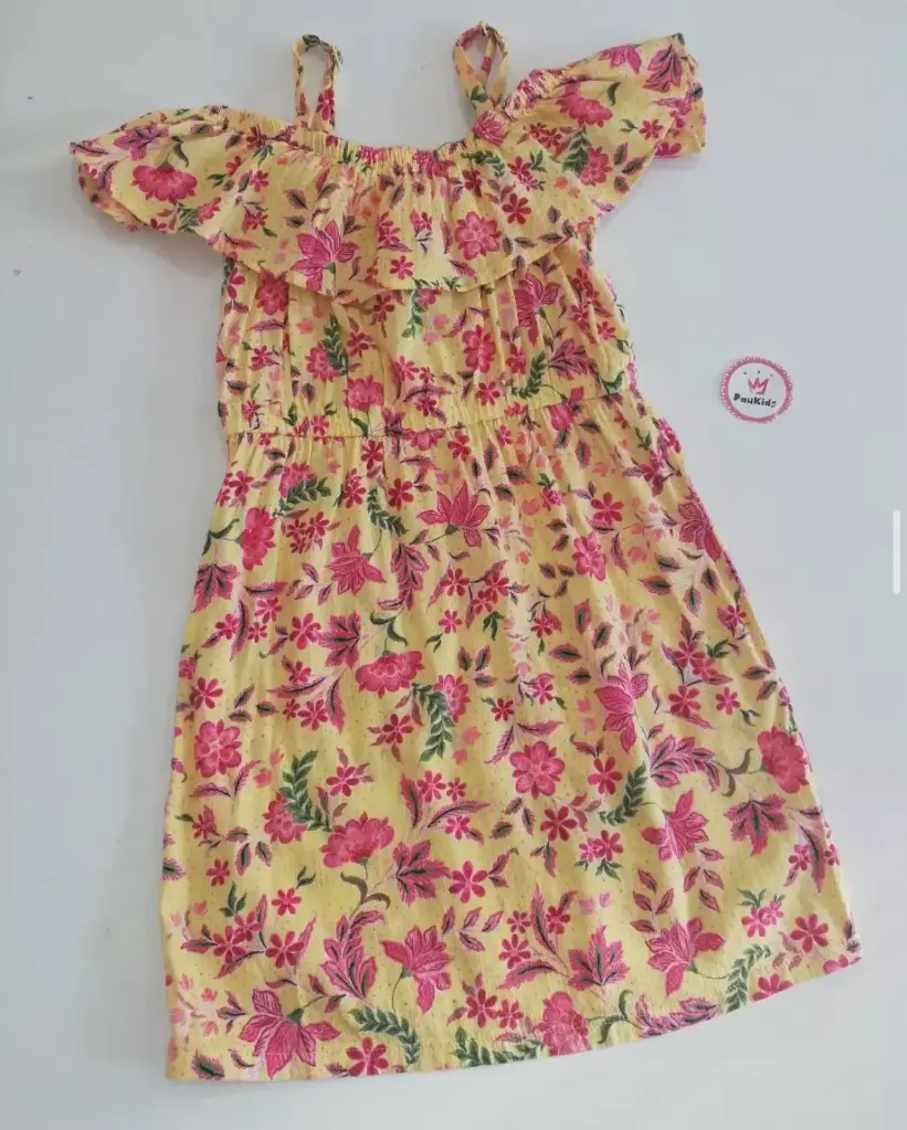 Vestido amarillo flores ruedo en tirantes